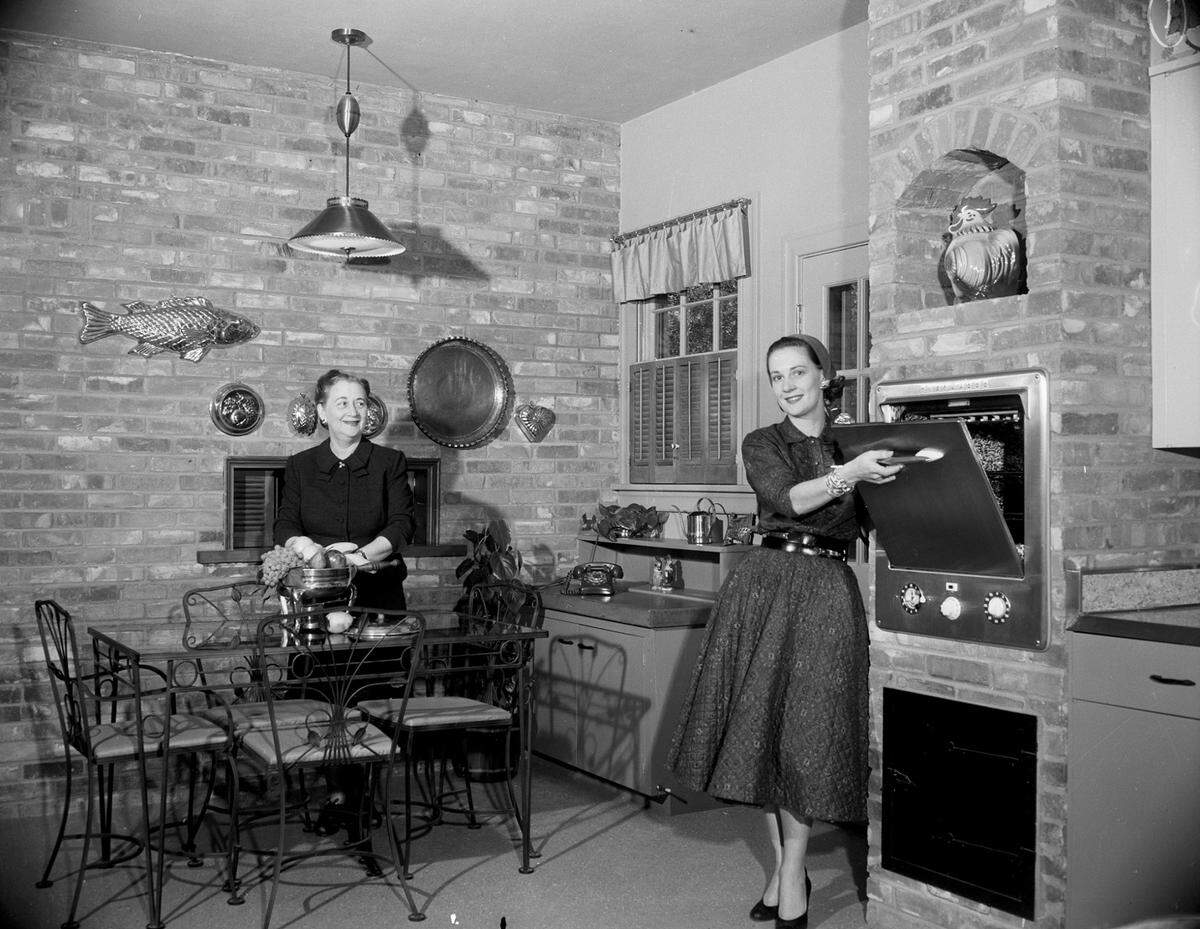 April 5, 1955: Mrs. Gordon W. Smith in her kitchen with her mother Mrs. E.E. Taylor, 3232 Avondale Ave., Fort Worth.