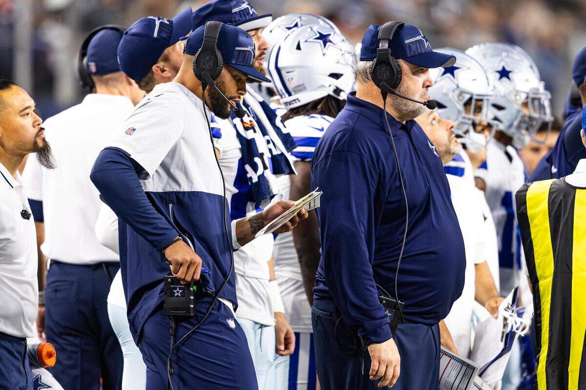 Dallas Cowboys quarterback Dan Prescott and head coach mike McCarthy call plays for the offense together on the sidelines in the first half of a preseason game against the Las Vegas Raiders at AT&T Stadium in Arlington, Texas on Saturday, Aug. 26, 2023.