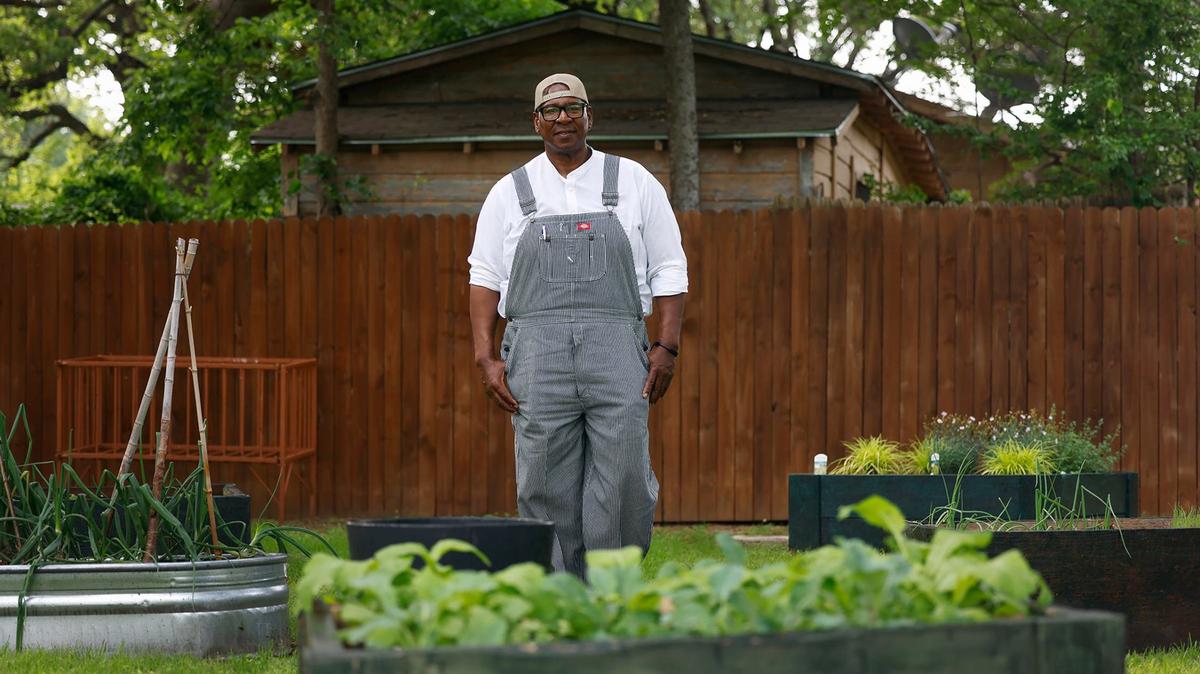 David Howard, a former NFL linebacker, stands in one of the community gardens he facilitated in the Stop Six neighborhood of Fort Worth on Wednesday, April 17, 2024. Howard has been investing in the Stop Six community of Fort Worth for over two decades. He is in the process of building a small farm, as well as a SNAP and EBT grocery store, to provide fresh fruits and vegetables to address food insecurity in the community.
