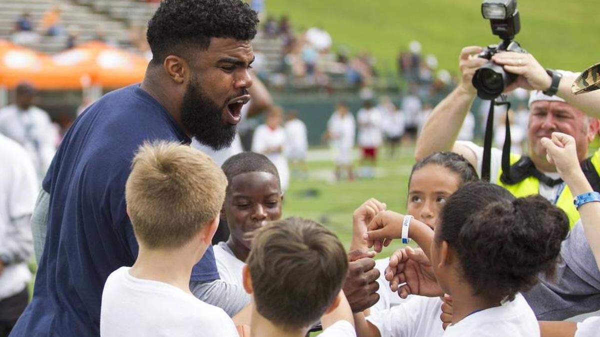 Cowboys running back Ezekiel Elliott, shown hosting his own camp in Grand Prairie last summer, is in Mexico today participating in a youth camp with the National Fantasy Football Convention.
