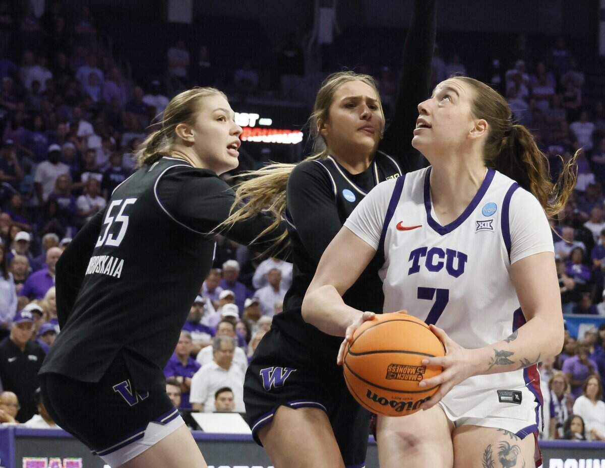 TCU forward Marta Suarez (7) gets a heavy guarded Washington defense during the first half of a second round NCAA Division I Women's Basketball Championship game at Schollmeier Arena in Fort Worth, Texas, Sunday, March, 22, 2026.