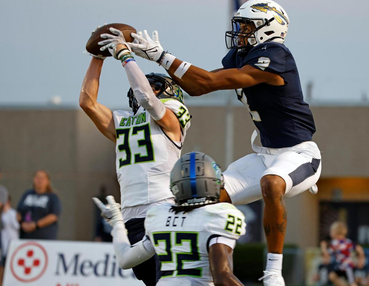 Eaton safety Ben Self (33) intercepts a ball intended for Keller wide receiver Tre’ Griffiths (2) at the goal line in the first half of a UIL high school football game at Keller ISD Stadium in Keller, Texas, Friday, Sept. 15, 2023. Keller led Eaton 31-14 at the half. (Special to the Star-Telegram Bob Booth)