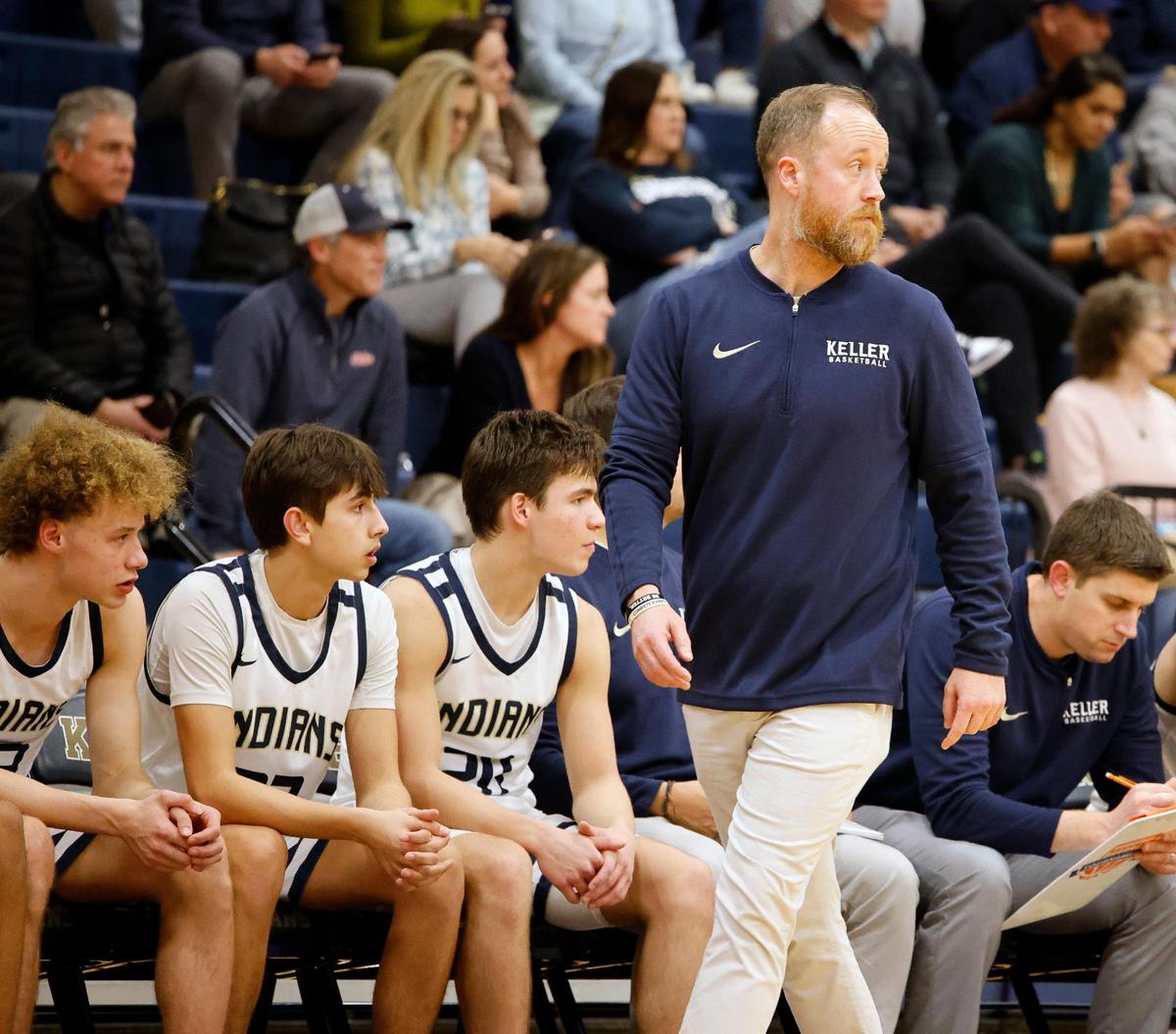 Keller head coach Zachary Weir glances back down court in the third period of a high school basketball game in the Keller High School gym in Keller Texas, Friday, Feb. 02, 2024.