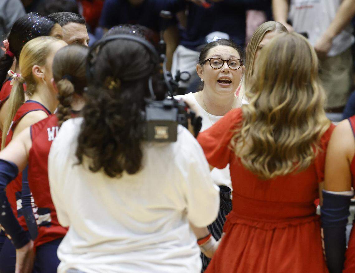 Wimberley head coach Misty Fletcher-Remmers talks to her team during a time out against Fort Worth Eagle Mountain in the second set of the UIL Class 4A Division II state volleyball championship game Friday Nov. 21, 2025 at Curtis Culwell Center in Garland, Texas.