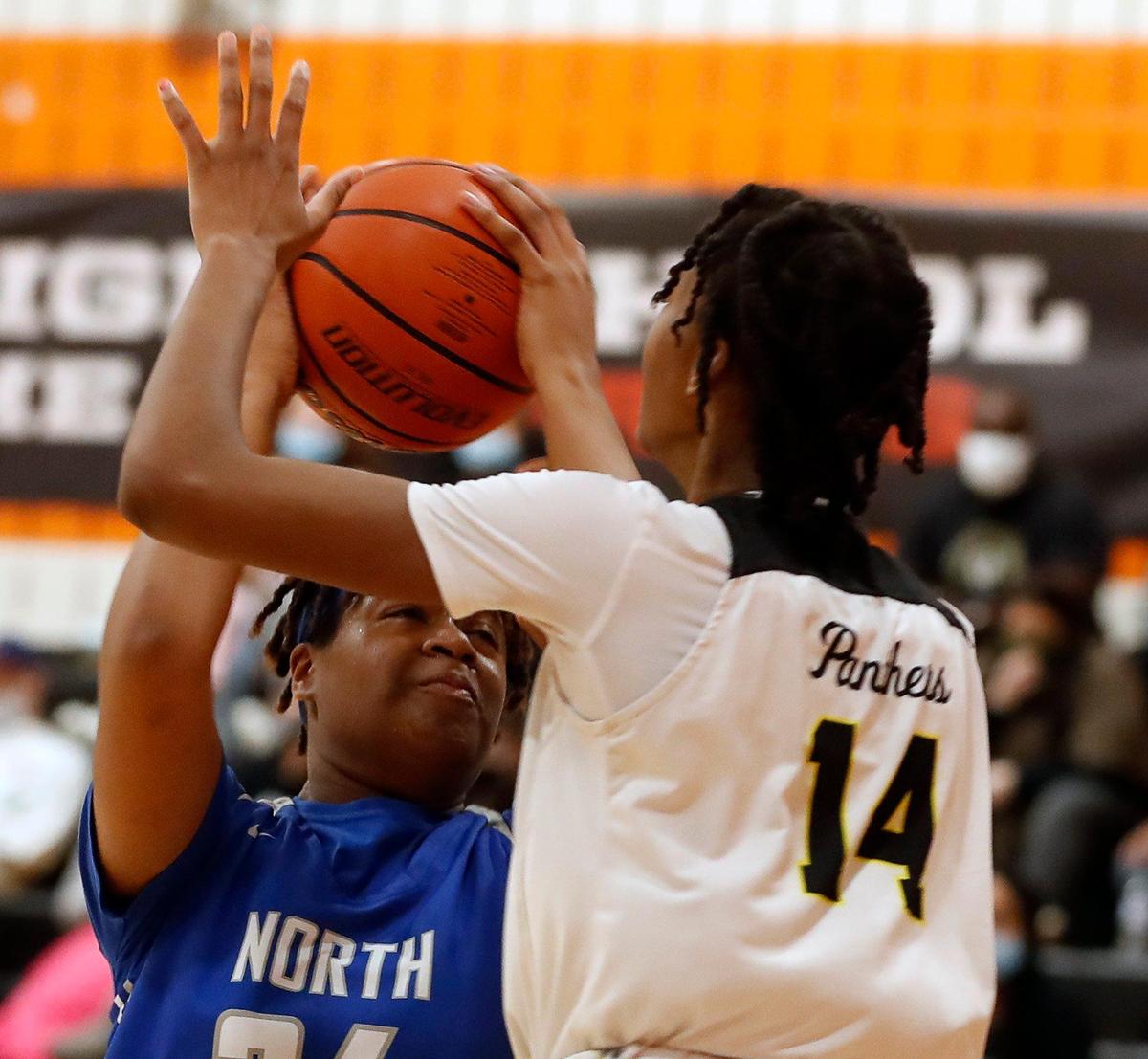 North Crowley center Amiya Hopkins (24) attempts a shot over Fossil Ridge’s Jade Masagayo (14) during the second half of a 6A Region 1 Bi-district girls basketball game at Haltom High School in Haltom City, Texas, Friday, Feb. 12, 2021. North Crowley defeated Fossil Ridge 44-41. (Special to the Star-Telegram Bob Booth)