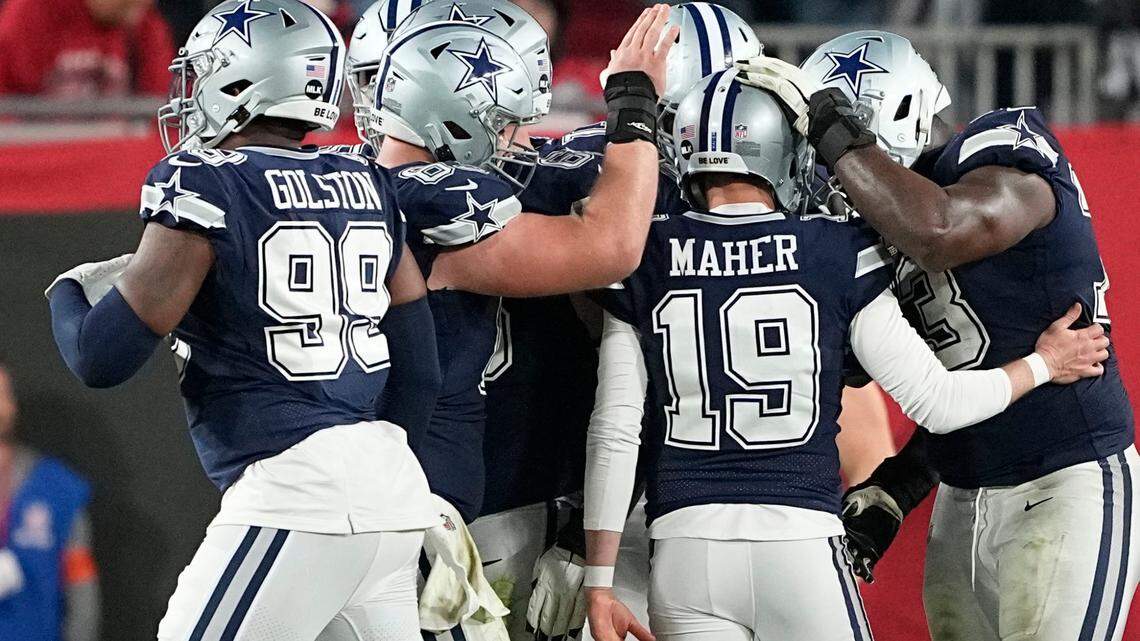 Dallas Cowboys place kicker Brett Maher (19) is congratulated after his extra point against the Tampa Bay Buccaneers during the second half of an NFL wild-card football game, Monday, in Tampa, Fla.