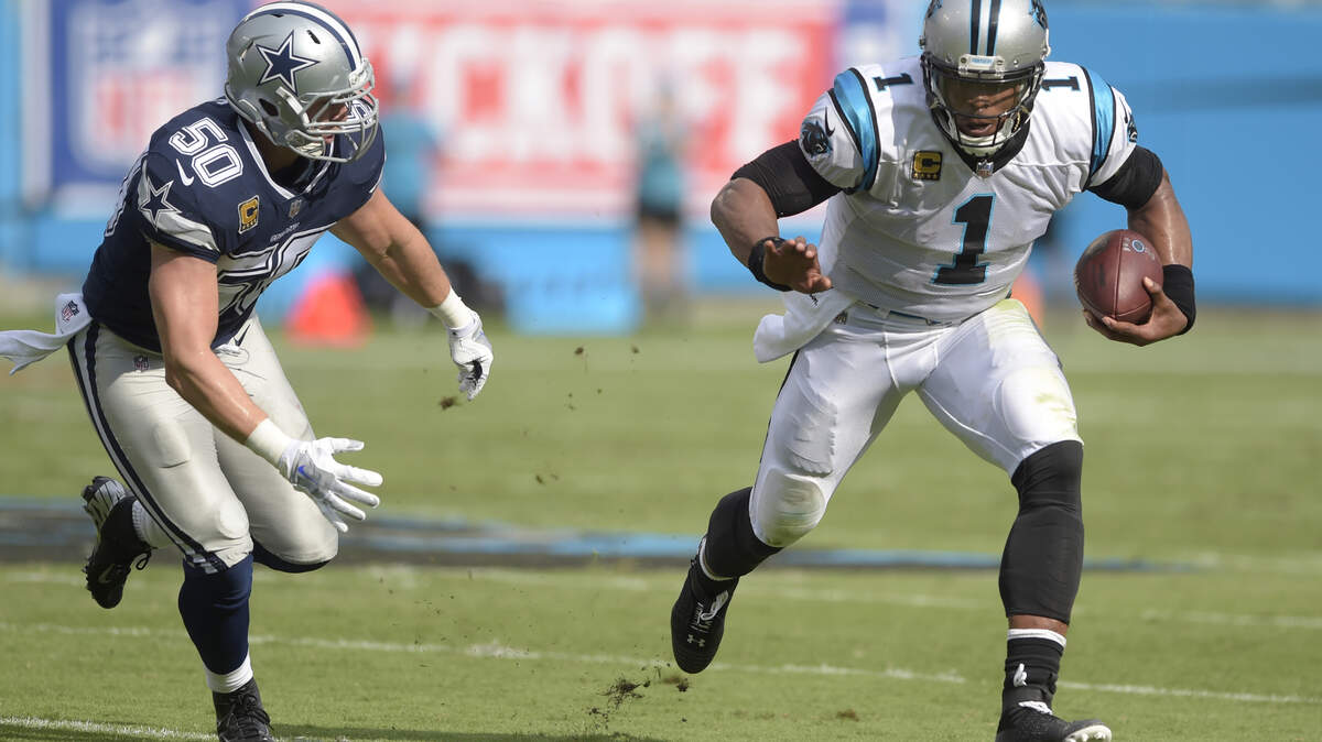 Carolina Panthers’ Cam Newton (1) runs past Dallas Cowboys’ Sean Lee (50) during the first half of an NFL football game in Charlotte, N.C., Sunday, Sept. 9, 2018.