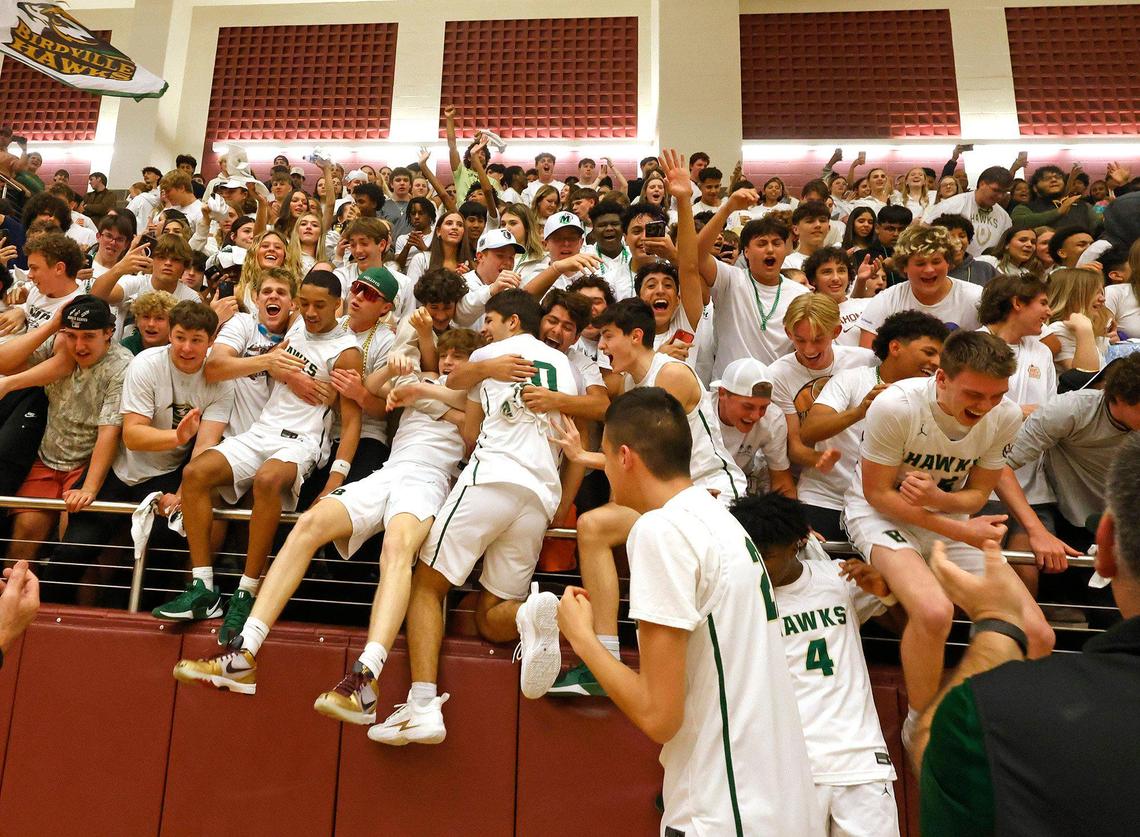 Birdville players jump into the stands with fans after beating Frisco Heritage in a Class 5A Division I state semifinal March 4, 2025, at Lewisville High School.
