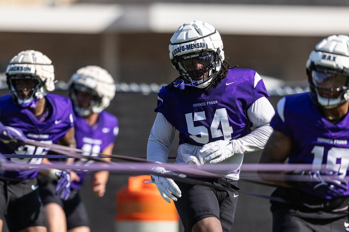 TCU defensive lineman NaNa Osafo-Mensah (54) participates in a defensive drill during the first practice of the season at the Sheridan & Cliff Morris Football Practice Fields in Fort Worth on Tuesday.