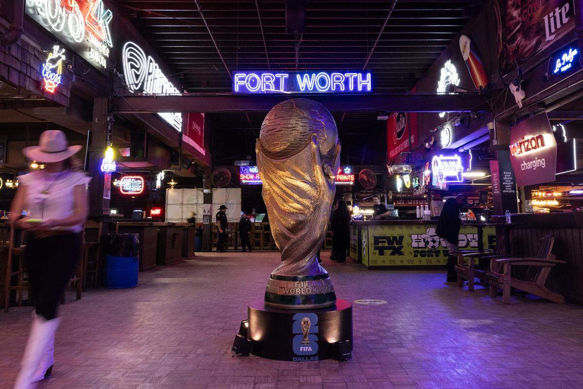 A model of the World Cup Trophy is placed in the middle of the venue for the 2025 World Cup Draw Watch Party at Billy Bobs Texas in the Fort Worth Stockyards on Friday, Dec. 5, 2025.