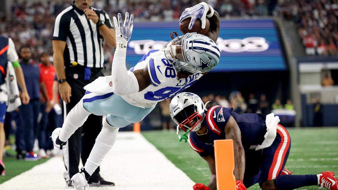 Dallas Cowboys wide receiver CeeDee Lamb attempts to stretch into the end zone while competing against the New England Patriots on Sunday, October 1, 2023, at AT&T Stadium in Arlington.