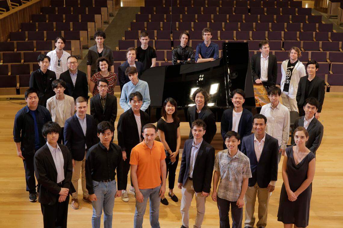 The 30 competitors for the 16th Cliburn International Piano Competition pose in Van Cliburn Concert Hall at TCU on Wednesday.
