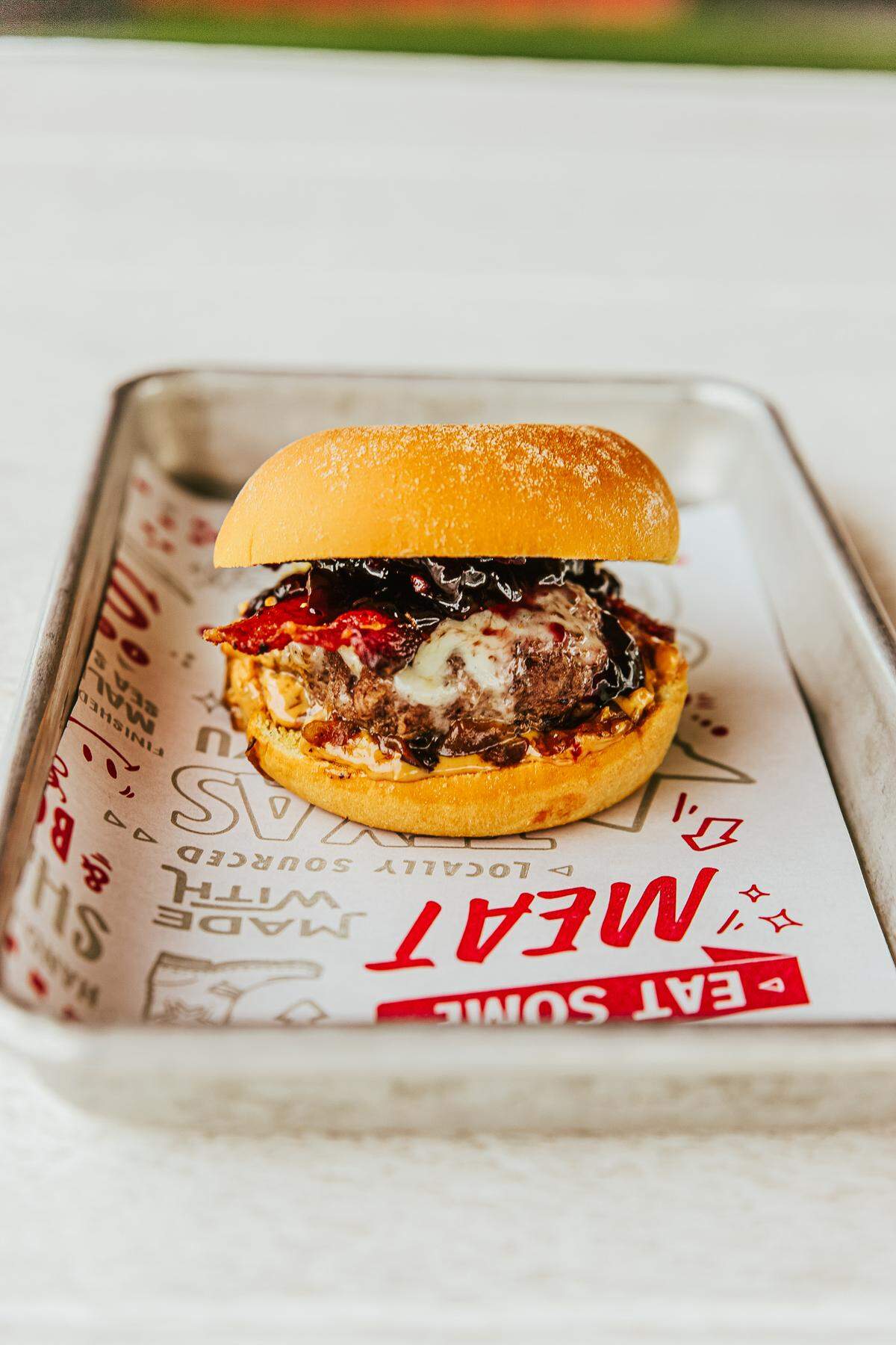 The PB&J wagyu beef slider at Son of a Butcher has blackberry jam, crunchy peanut butter, bacon, cilantro and rosemary lime aioli