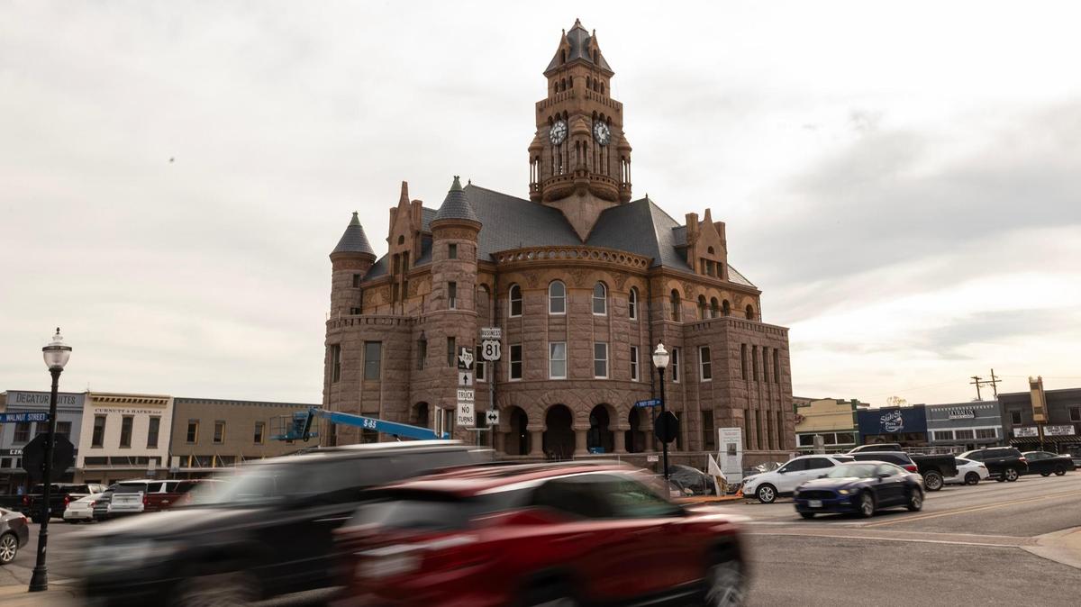 Cars drives down E Walnut Street past the Wise County Courthouse currently under construction in Decatur Town Square on Thursday, March 29, 2025.