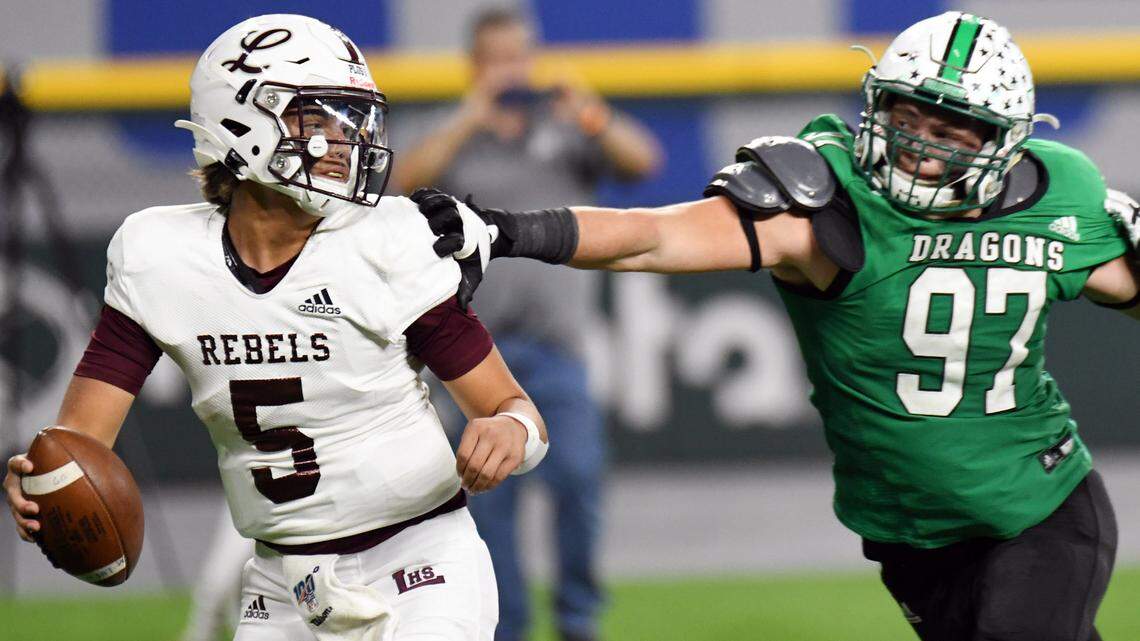 Midland Legacy quarterback Marcos Davila, left, tries to avoid pressure against Southlake Carroll during a football game Saturday, November 20, 2021 at Globe Life Field in Arlington, Texas. The four-star quarterback became TCU’s first 2024 commitment. Special/Bob Haynes