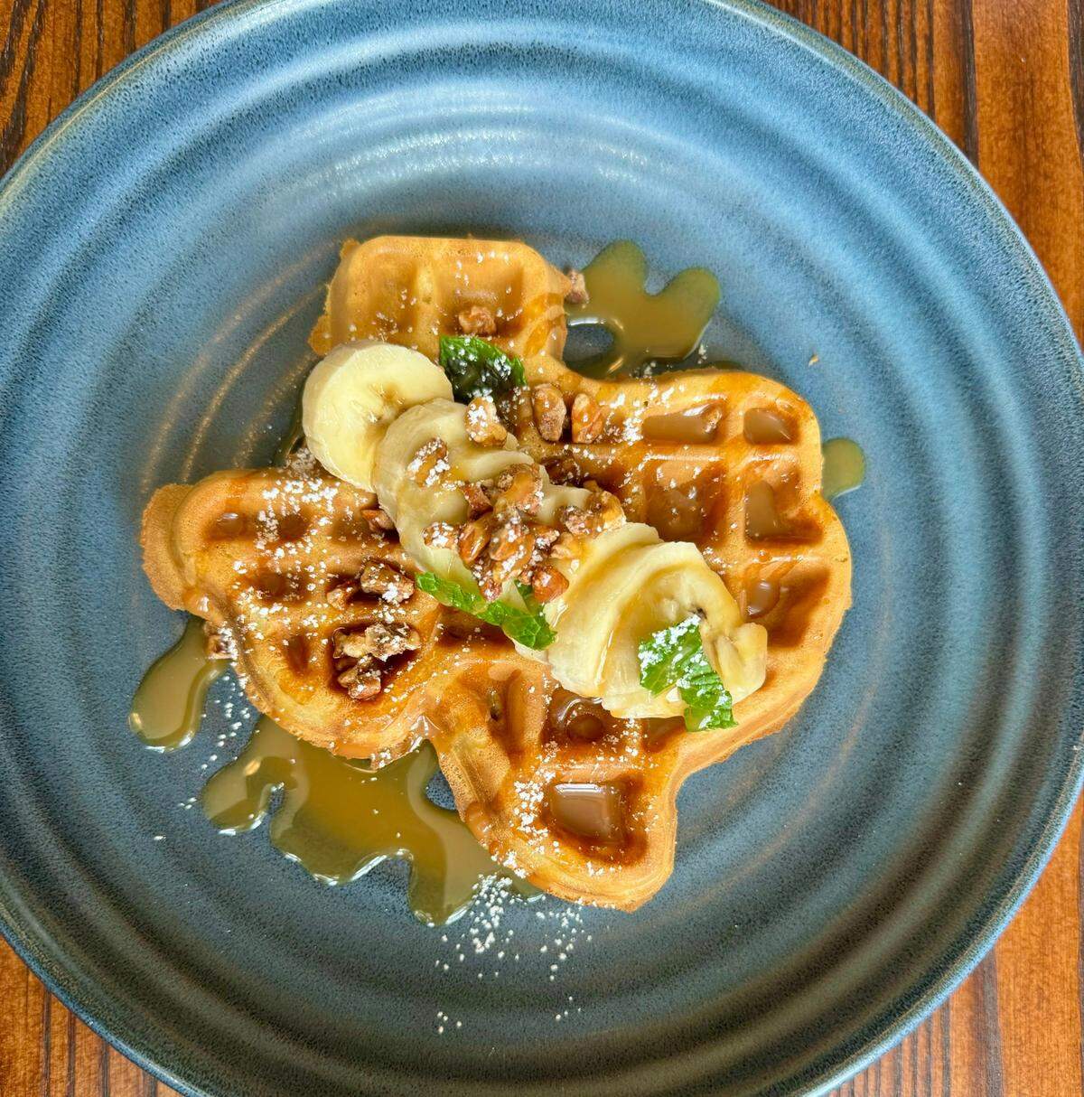 The Texas waffle with banana and caramel sauce at Second Bar + Grill in Mineral Wells, Texas, March 24, 2024.