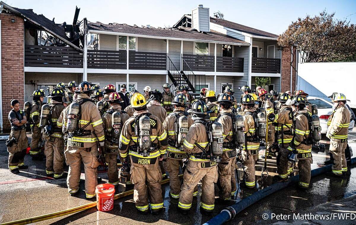 Fort Worth firefighters respond to a fire at 13716 Gazebo Lane on Wednesday, Dec. 9, 2025. An official said almost 50 residents were displaced and one firefighter suffered burn injuries.