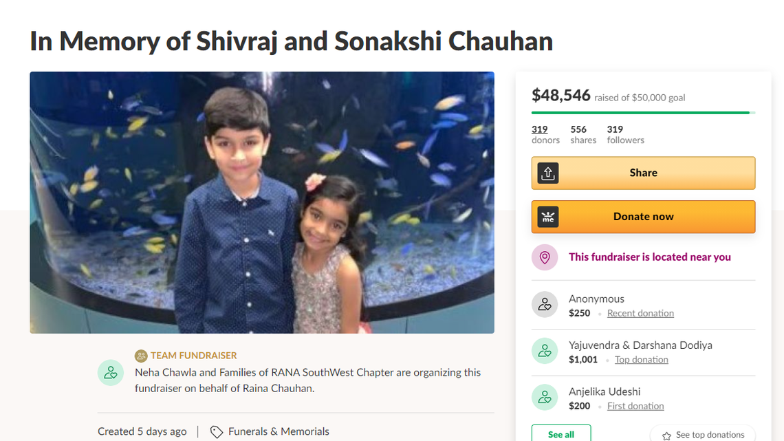 Shivraj Chauhan (left) and his sister Sonakshi Chauhan (right) pose for a photo in front of a tank of fish. The two were killed on April 3 when they were riding in the bucket of a backhoe and their father, who was operating the machine, caused it to dump, authorities said. The father was arrested on multiple charges.
