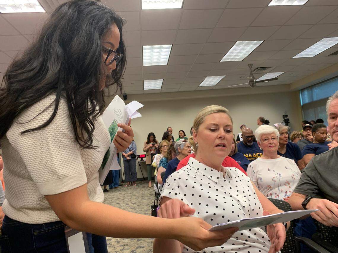 Attendees were handed documents about the Tarrant County redistricting at the Arlington town hall meeting on May 17, 2025. The packet included maps with the minority voter data, Precinct 2 Commissioner Alisa Simmons’s official statements on the redistricting and an email exchange requesting the map drawer attend the meeting, which he did not.