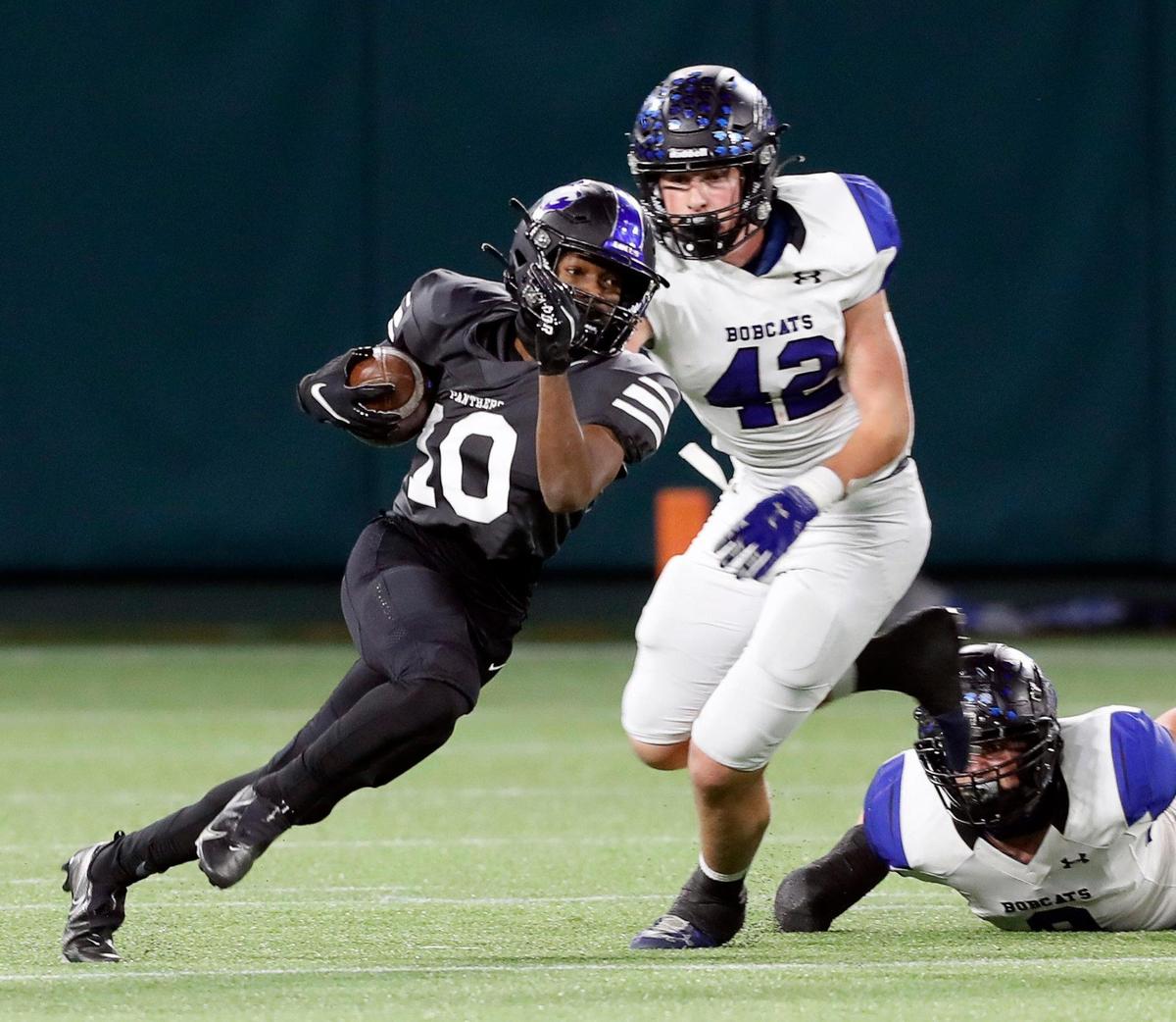 North Crowley quarterback Quinton Jackson (10) escapes the backfield pressured by Byron Nelson’s Jason Rawe (42) during a high school 6A Division 2 bi-district football playoff game at Globe Life Park in Arlington, Texas, Friday, Dec. 11, 2020. Byron Nelson led 7-3 at the half. (Special to the Star-Telegram Bob Booth)