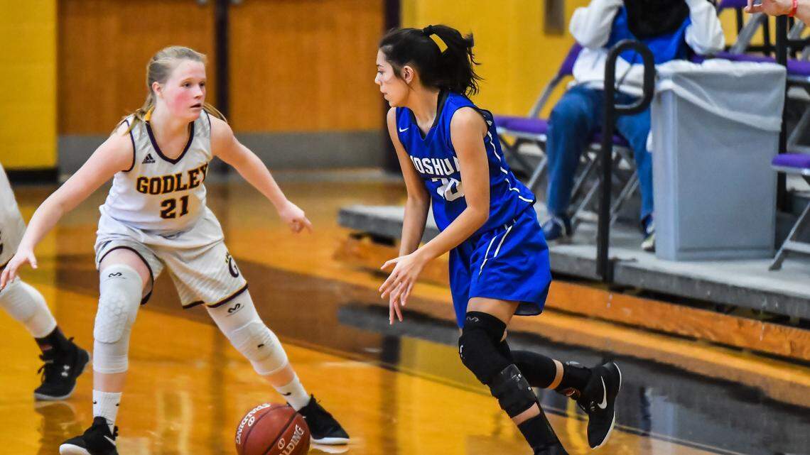 Joshua sophomore Gabbie Guerrero, right, dribbles the ball against Godley in a nondistrict game, Tuesday, Dec. 31, 2019.