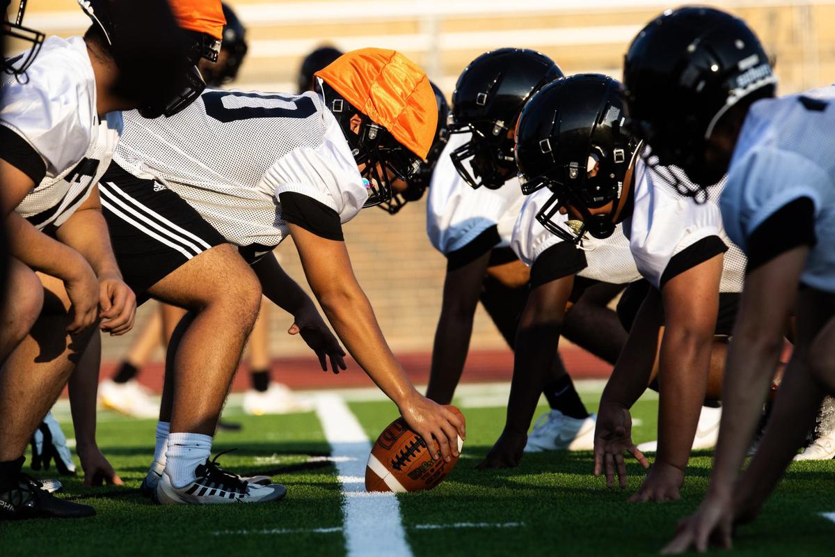 Players line up for a drill on Monday, August 5 at Eagle Mountain High School. EMHS hosted their heir inaugural football practice for their new team.