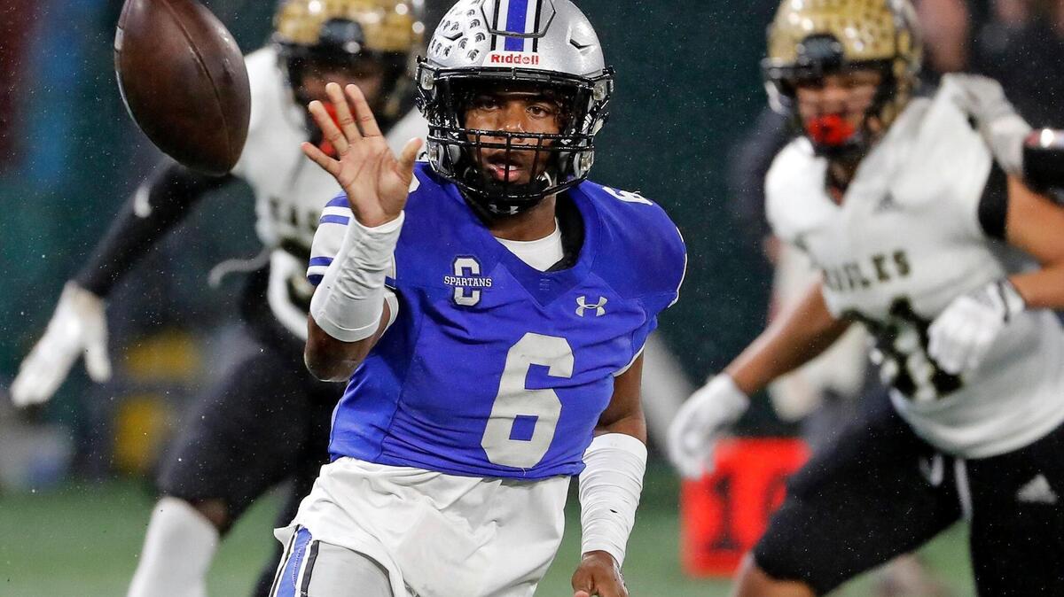 Burleson Centennial quarterback Phillip Hamilton (6) pitches out on a RPO in the first half of Class 5A D1 regional semi-finals football game at Choctaw Stadium in Arlington, Texas, Friday, Nov. 25, 2022. (Special to the Star-Telegram Bob Booth)