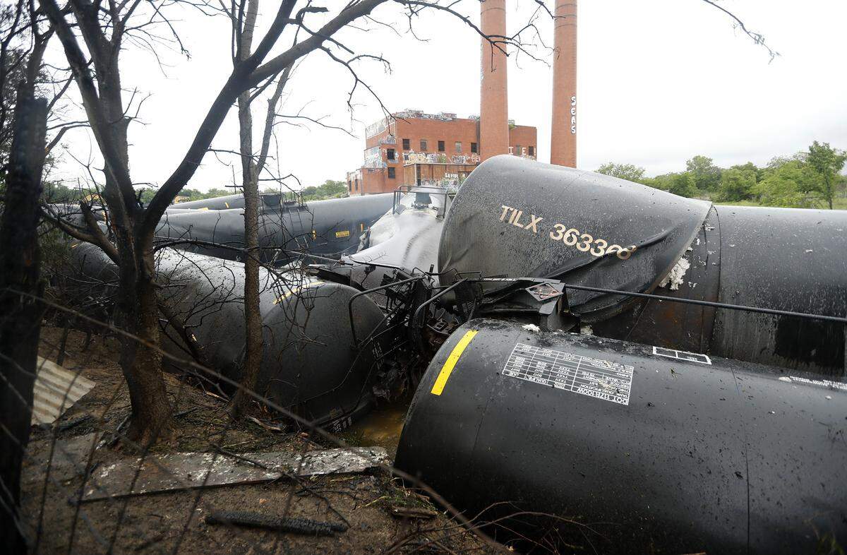 Homes were evacuated early Wednesday in several Fort Worth neighborhoods when train cars caught fire after derailing, fire officials said. The Union Pacific train derailed west of the intersection of Riverside and East Berry.