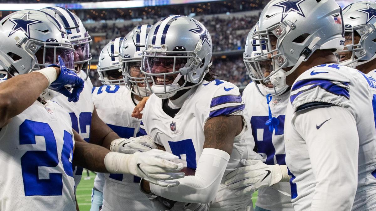 Trevon Diggs, center, celebrates his NFL-leading eighth interception of the season with teammates Sunday in Arlington. The Cowboys picked off three Falcons passes and did not allow a third down conversion.