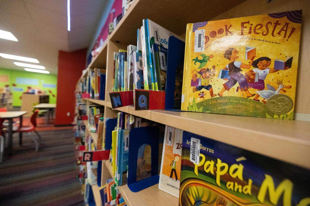 A new funding model has allowed M.H. Moore Elementary School and other schools in Fort Worth ISD to buy more books for their libraries.