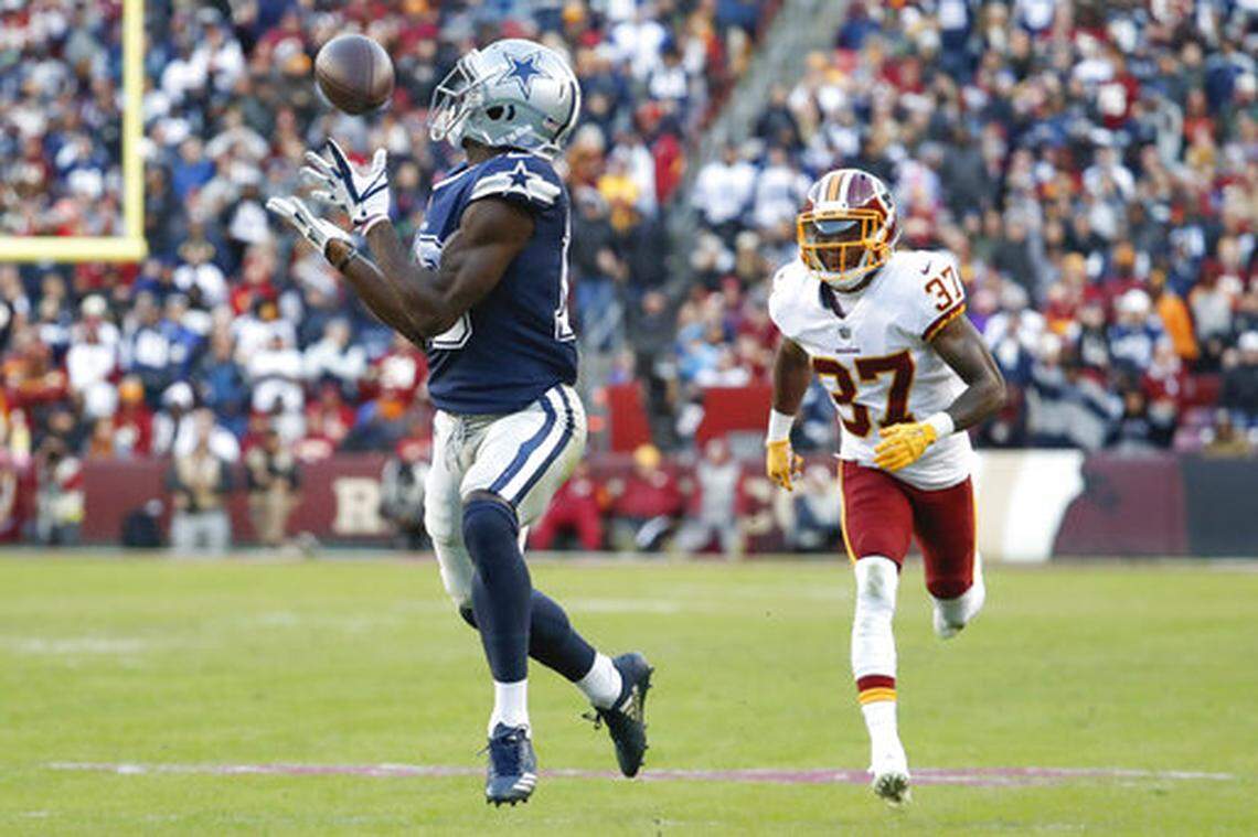 Dallas Cowboys wide receiver Michael Gallup (13) pulls in a touchdown pass as Washington Redskins defensive back Greg Stroman (37) pursues during the first half of an NFL football game, Sunday, Oct. 21, 2018 in Landover, Md. (AP Photo/Andrew Harnik)