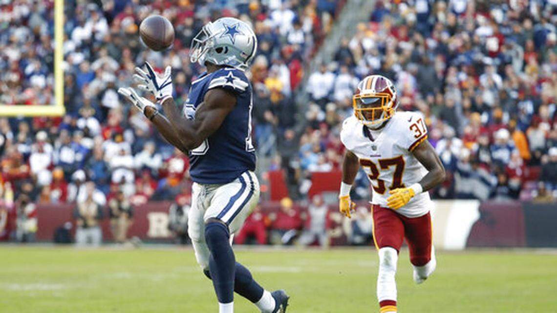 Dallas Cowboys wide receiver Michael Gallup (13) pulls in a touchdown pass as Washington Redskins defensive back Greg Stroman (37) pursues during the first half of an NFL football game, Sunday, Oct. 21, 2018 in Landover, Md. (AP Photo/Andrew Harnik)