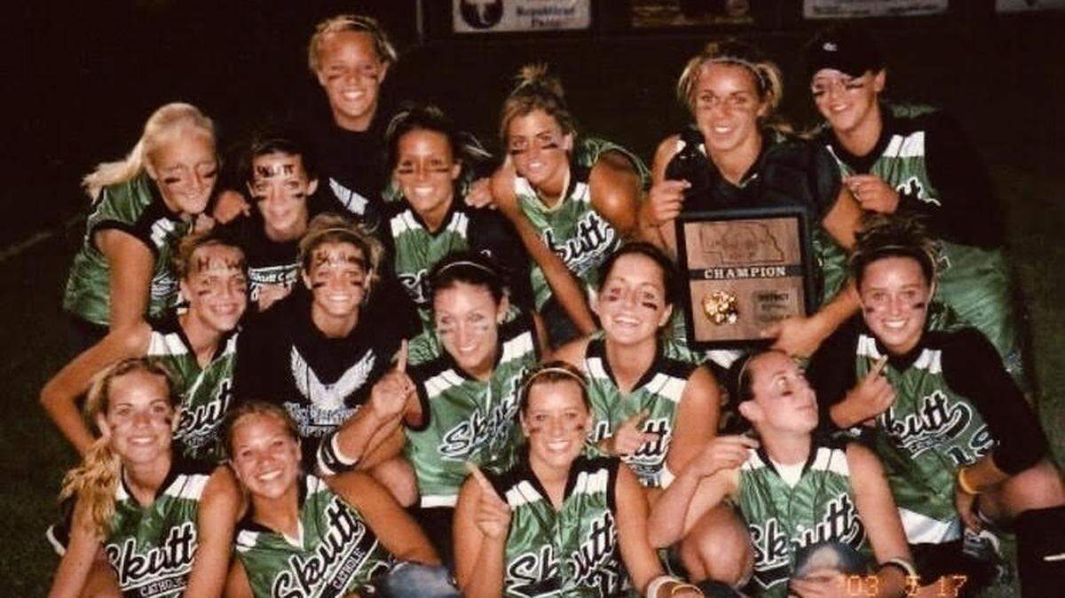 A team photo of the Omaha Skutt Catholic high school softball team from the 2004 Nebraska state playoffs. Bottom left is current Bally Sports anchor Erin Hartigan. Holding the plaque is Rachel Balkovec, who will soon become the first female to manage an affiliated pro baseball team in the United States. Balkovec is the manager of the Class A Tampa Tarpons in the New York Yankees’ system.