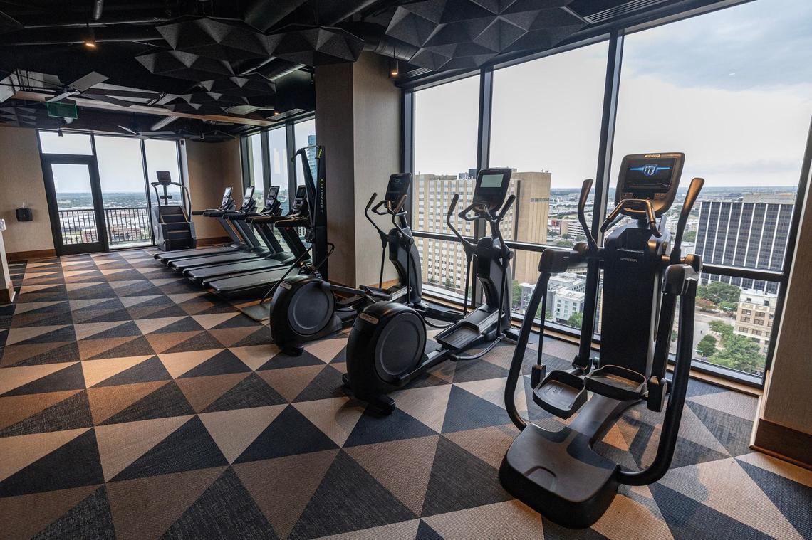 The gym looking out to the downtown skyline on the 24th floor of the new Deco 969 High-Rise Apartments in downtown Fort Worth on Wednesday, July 17, 2024.
