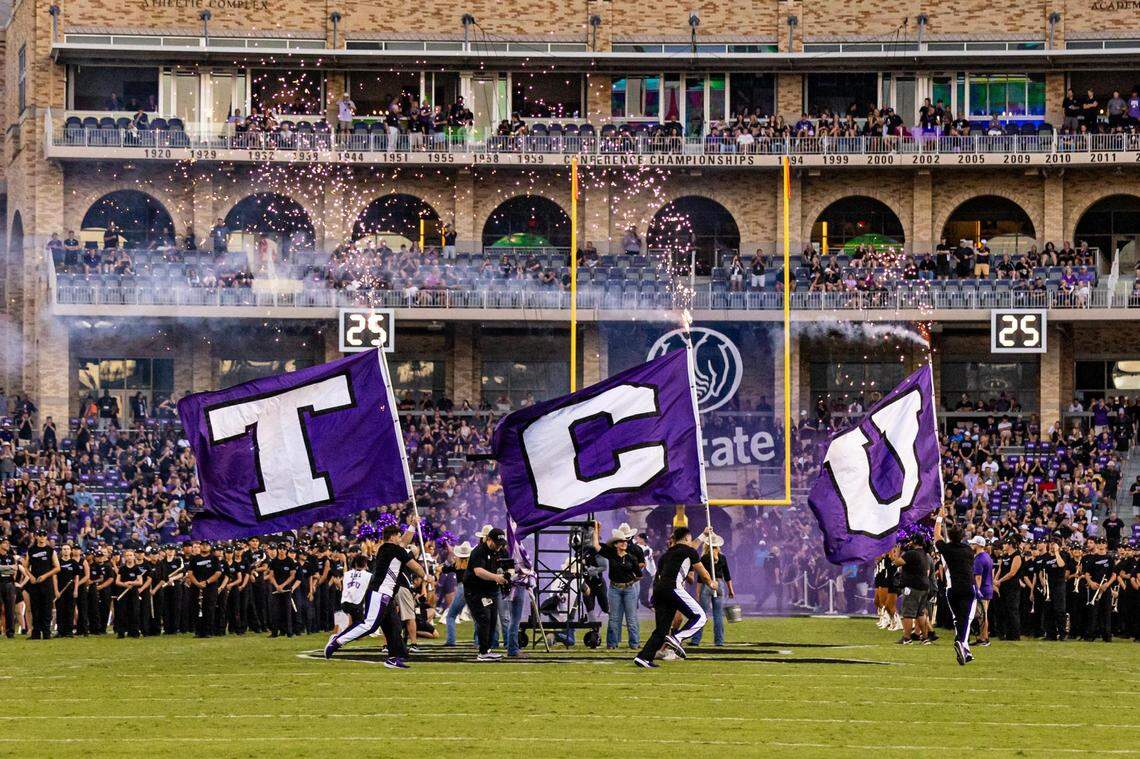 The TCU cheer team introduced the team prior to a Big XII conference game between the TCU Horned Frogs and the West Virginia Mountaineers at Amon G. Carter Stadium in Fort Worth on Saturday, Sept. 30, 2023.