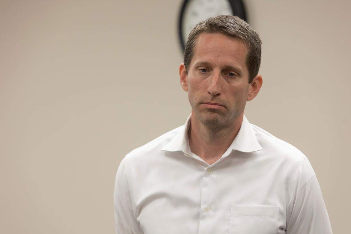 After speaking during public comment, Chandler Crouch listens to the Tarrant Appraisal District board on Thursday, June 30, 2022, in Fort Worth, Texas. Crouch’s clients showed up to support him during the emergency meeting.
