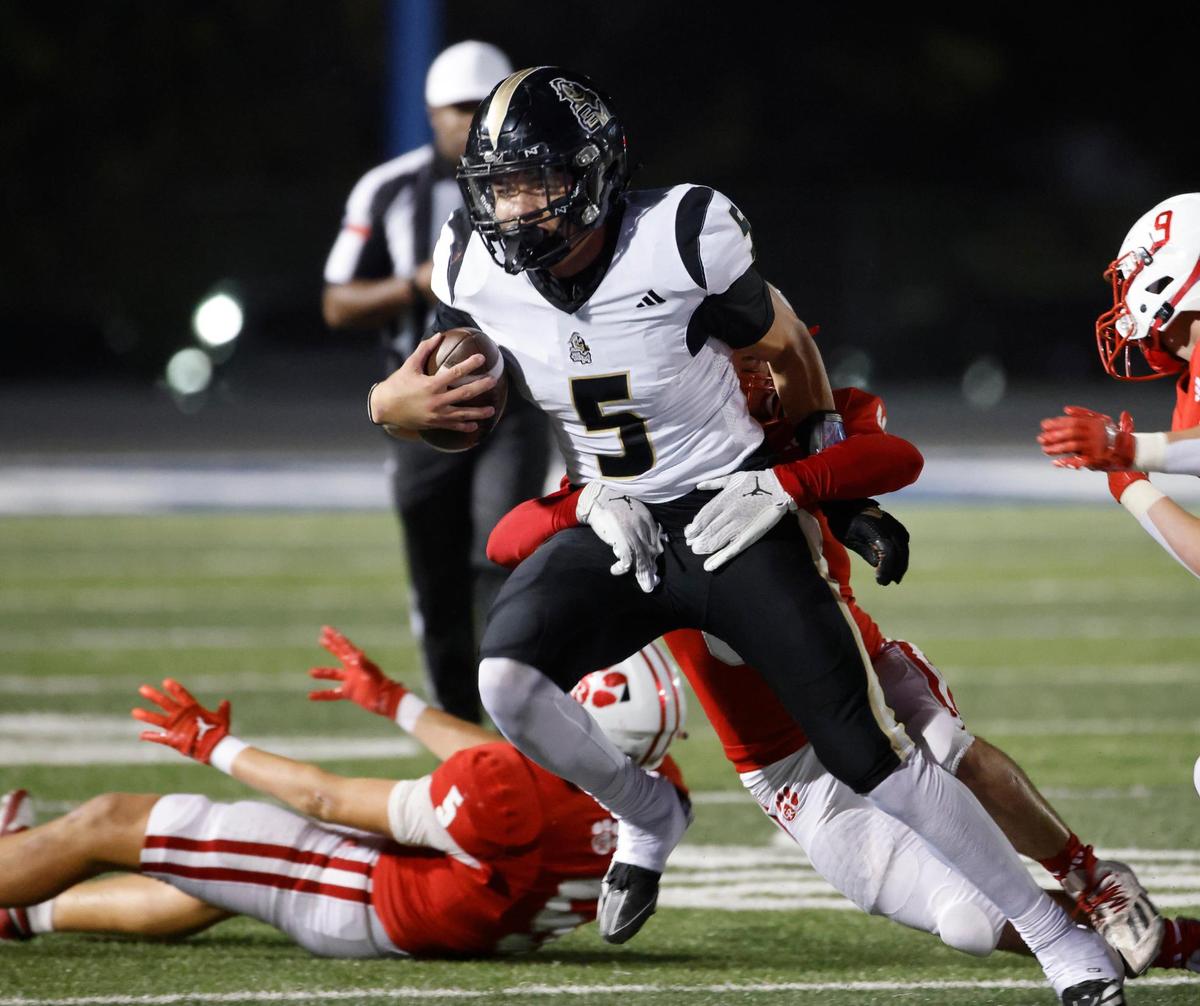 Eagle Mountain runner Justin Fox (5) is stopped in the middle during an UIL 4A D2 Region 1 Bi-district football playoff game at Kangaroo Stadium in Weatherford, Texas, Friday, Nov. 15, 2024.