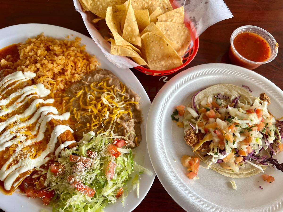 An enchllada-and-relleno combination plate and a fish taco at Vaqueros in Watauga.