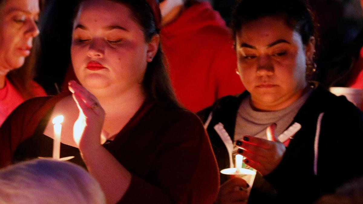 People attend a vigil to celebrate the short life of 7-year-old Athena Strand, at The First Baptist Church in Cottondale, Texas, on Dec. 06.