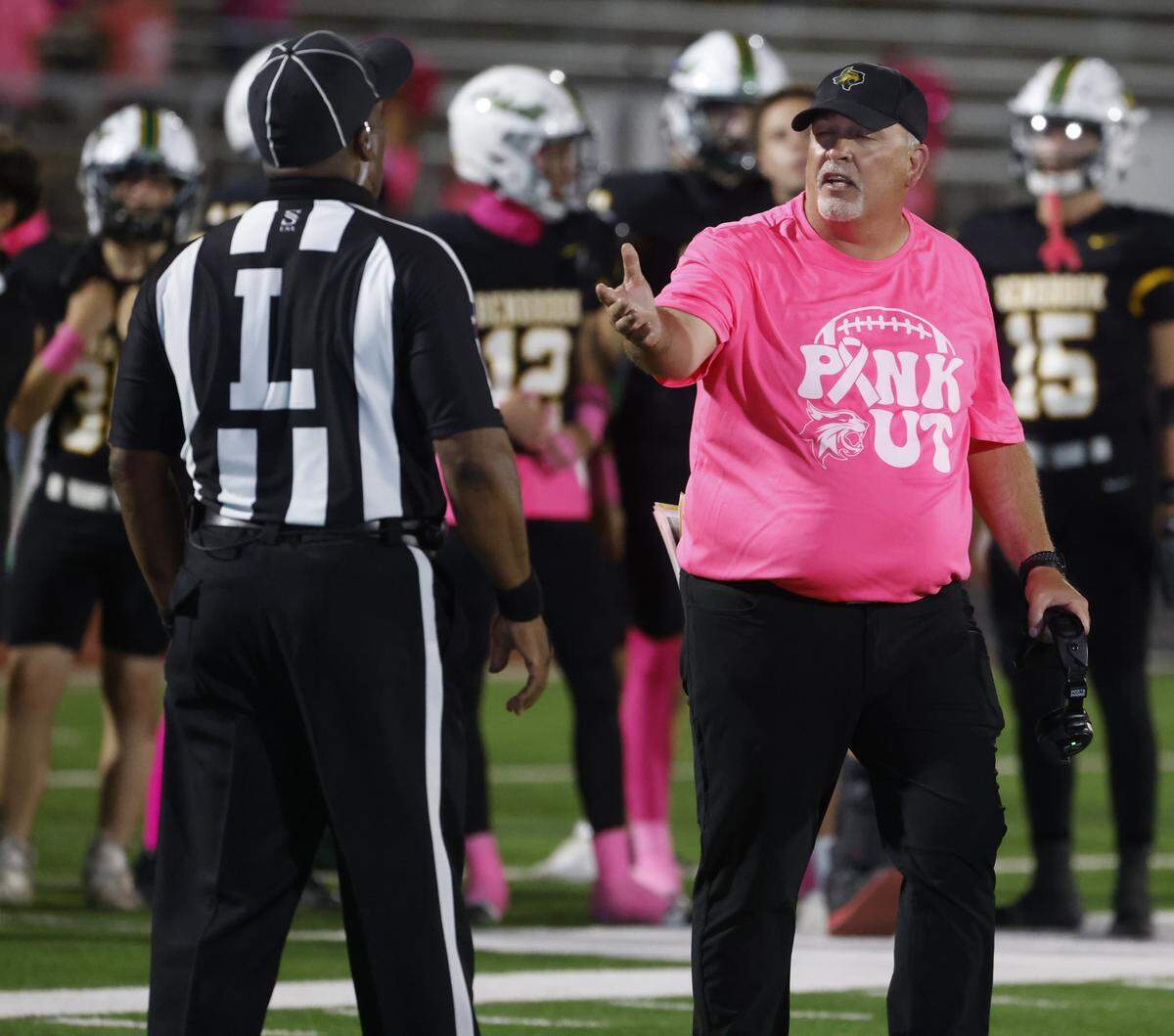 Benbrook head coach Cody Slater questions the linesman about a call during the second half of a UIL football game between Benbrook and Dunbar at Herman E. Clark Stadium in Fort Worth, Texas, Friday, October 10, 2025.