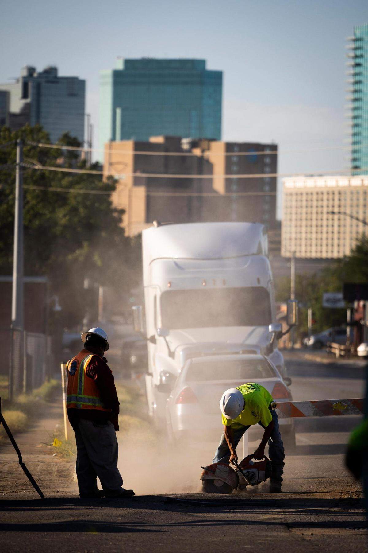 Construction crew work in the summer heat Friday, July 8, 2022, in Fort Worth.