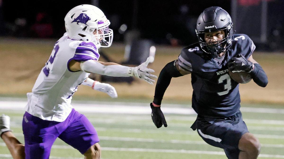 Timberview quarterback Cameron Bates (3) runs past the outstretched arms of Sunset defensive back Joel Gonzalez (12) in the first half of a UIL football game at Vernon Newsom Stadium in Mansfield, Texas, Thursday, Oct. 19, 2023.