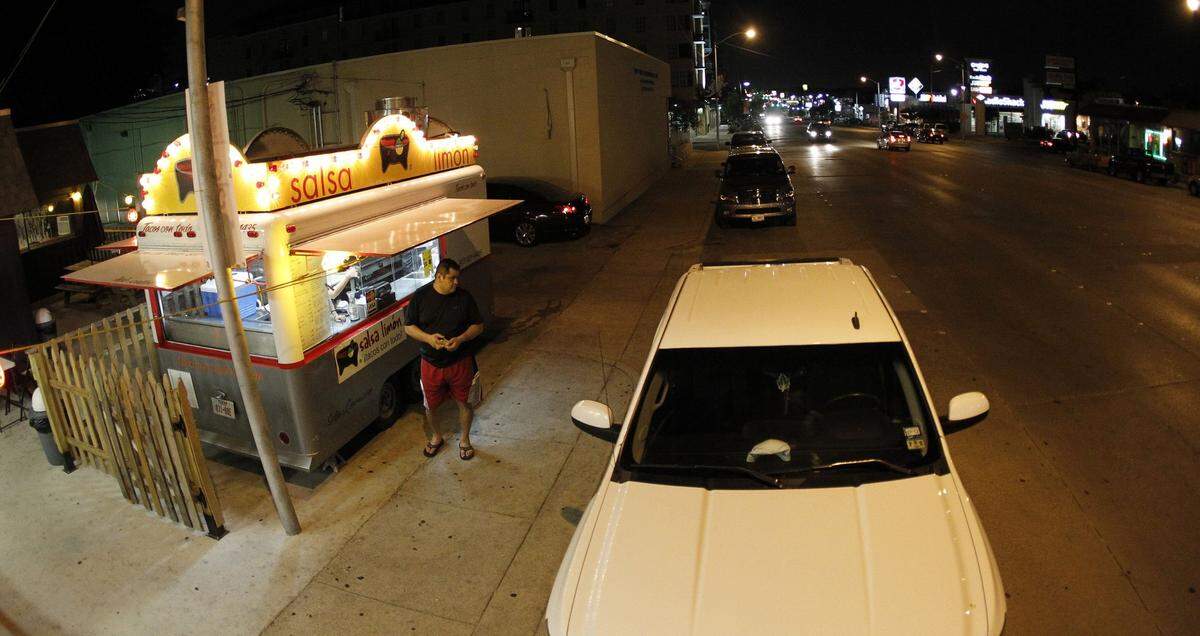 July 16, 2011: Customer Eli Vega waits for his order at the Salsa Limon food truck on Berry Street near TCU.