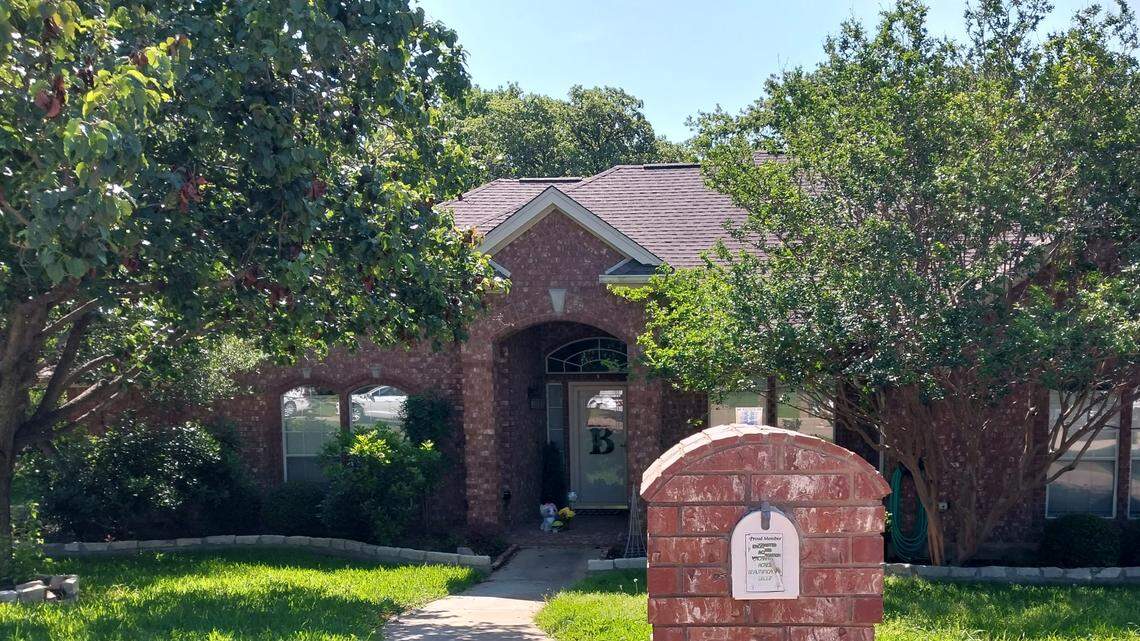 Well-wishers left flowers, a balloon, a stuffed animal and other items outside the home where a Mansfield man is accused of shooting his son and stepdaughter the night of May 16, 2023.