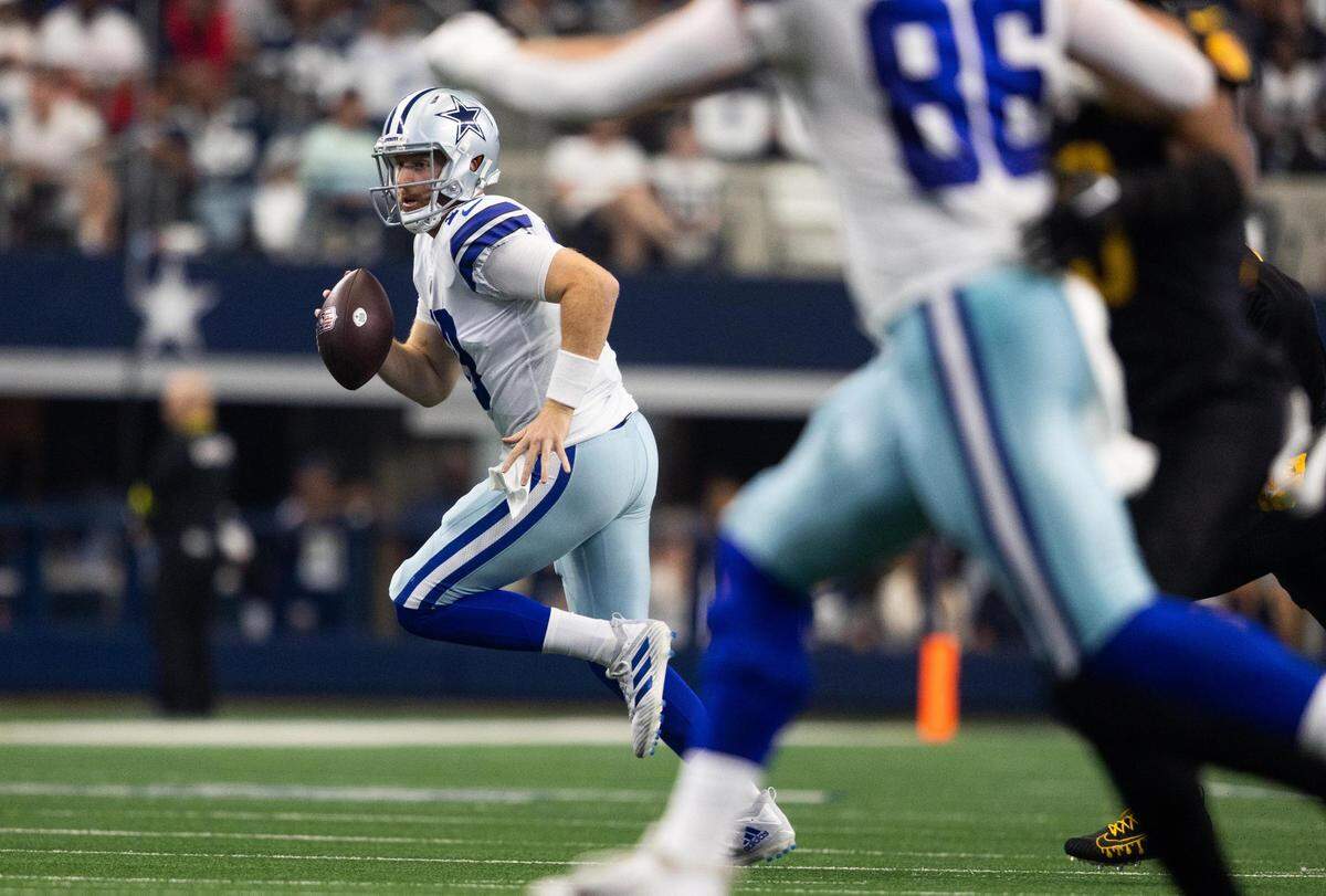 Dallas Cowboys Cooper Rush runs the ball during the game against Washington Commanders on Sunday, Oct. 2, 2022, at AT&T Stadium in Arlington.
