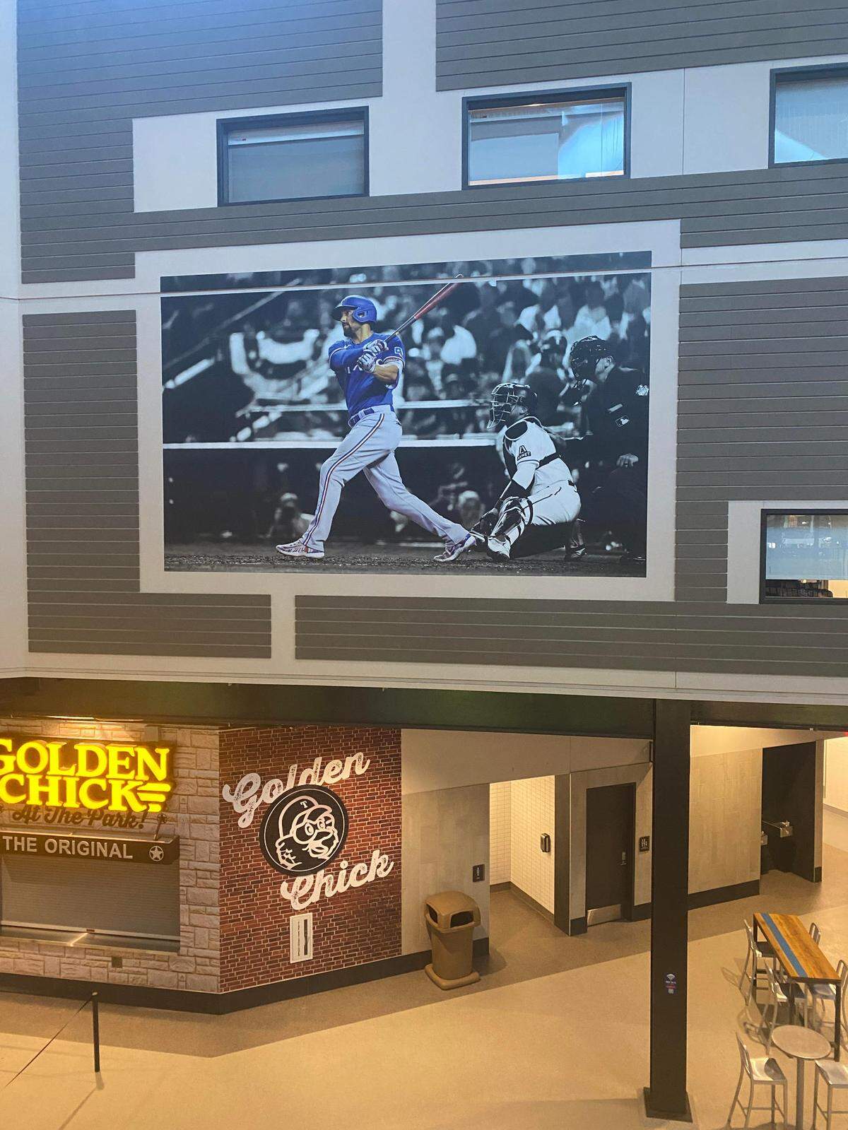A poster showing Marcus Semien hitting during the 2023 World Series against the Arizona Diamondbacks.