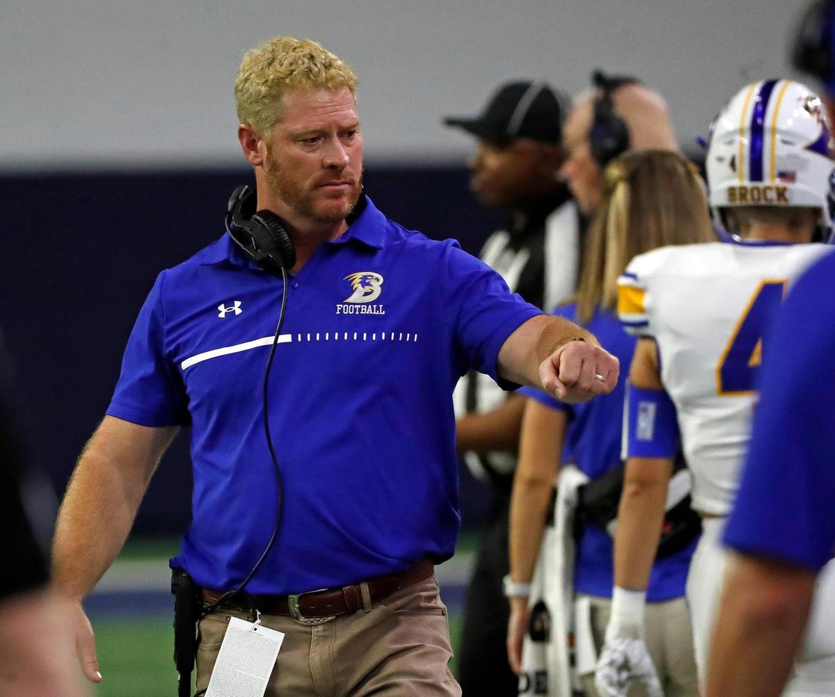 Brock head coach Billy Mathis fist bumps players on the sidelines in the second half of a UIL Class 3A D1 state semifinal football game at the Ford Center in Frisco, Texas, Thursday, Dec. 08, 2022. Brock defeated Malakoff 21-10. (Special to the Star-Telegram Bob Booth)