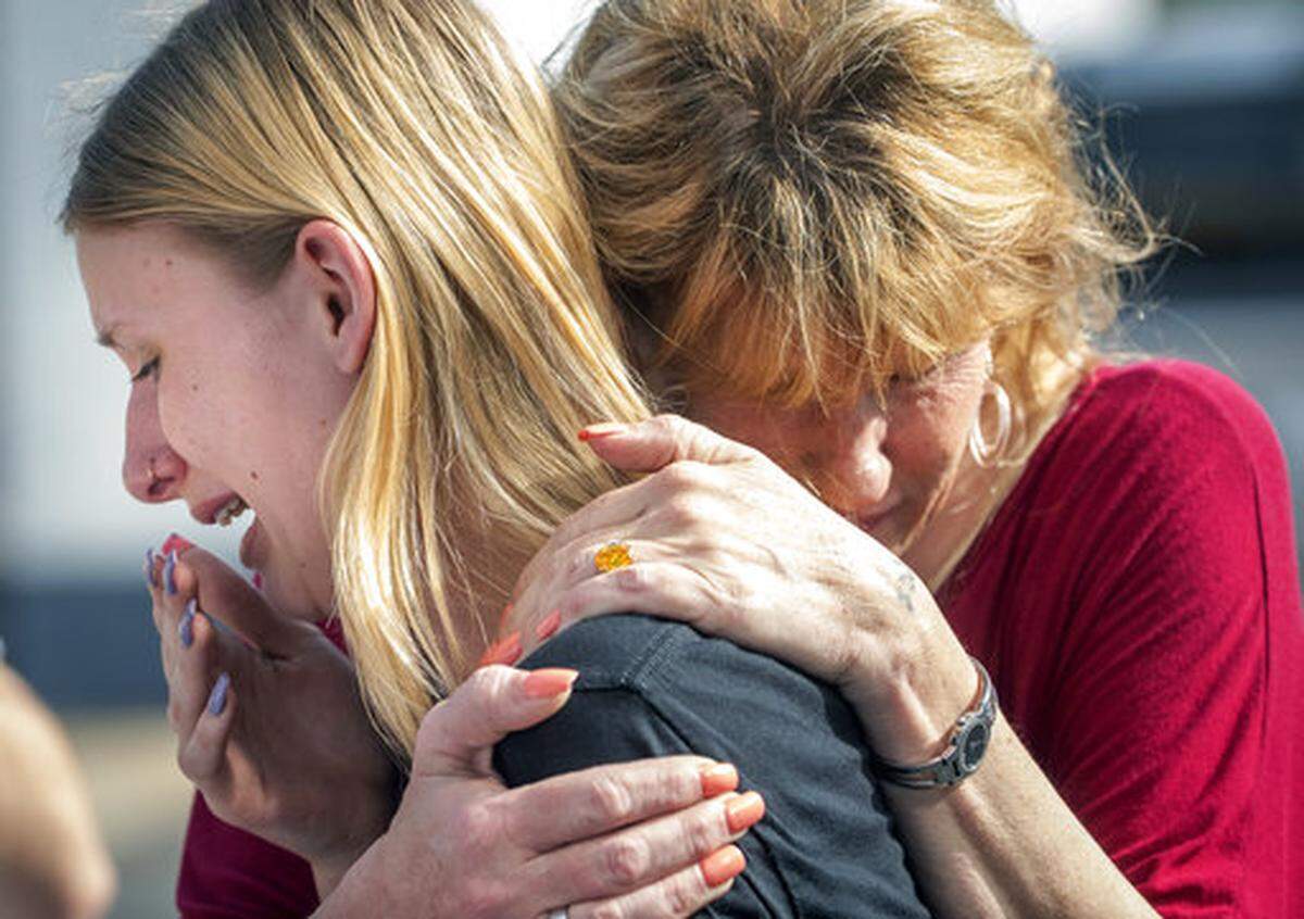 In this May 18, 2018 file photo, Santa Fe High School student Dakota Shrader is comforted by her mother Susan Davidson following a shooting at the school in Santa Fe, Texas, where 10 people were shot to death in May.