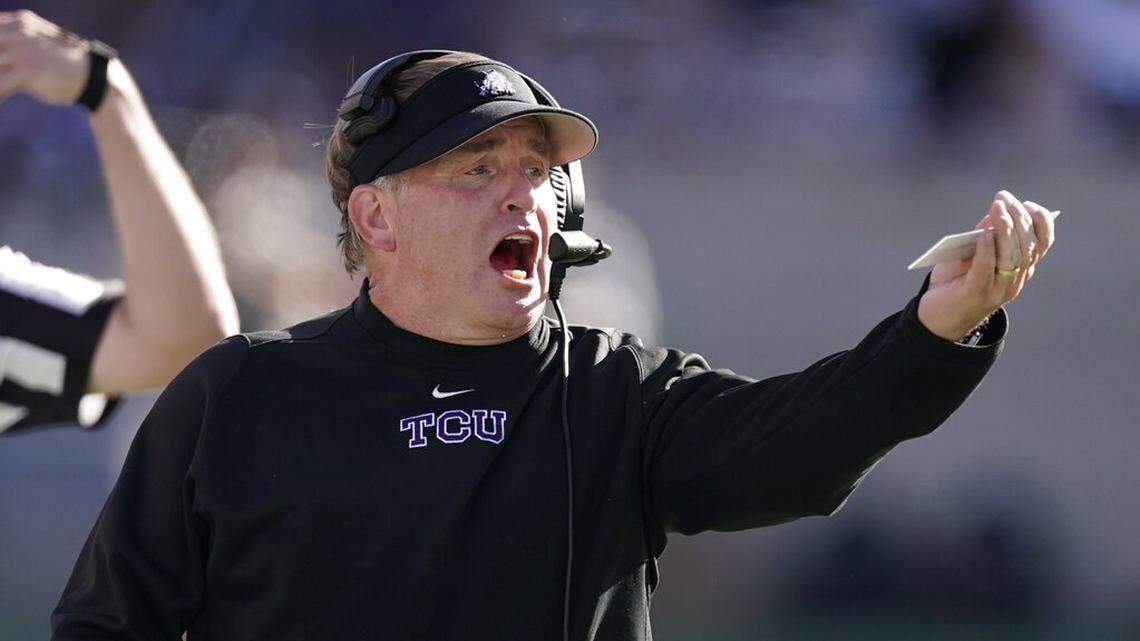 TCU head coach Gary Patterson talks to his players during the first half of an NCAA college football game against Kansas State, Saturday, Oct. 30, 2021, in Manhattan, Kan. (AP Photo/Charlie Riedel)