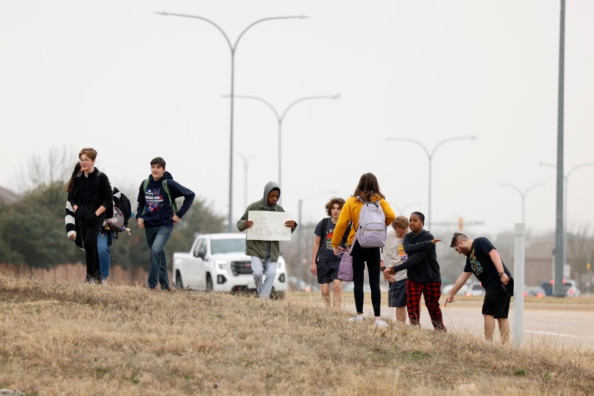 Timber Creek High students gather with other Keller ISD students after walking out of school on Friday, Feb. 7, 2025, to protest the proposed split of the school district.